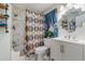Updated bathroom featuring a shower/tub combination, vanity, and mirror at 1506 37Th St, Orlando, FL 32839