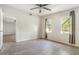 Bright bedroom features a ceiling fan, wood-look floors, and two windows with natural light at 1506 37Th St, Orlando, FL 32839