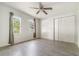 Bright bedroom featuring sleek wood-look flooring and closet at 1506 37Th St, Orlando, FL 32839
