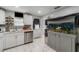 Bright kitchen featuring stainless steel appliances, white cabinetry, and a built-in fish tank at 1506 37Th St, Orlando, FL 32839