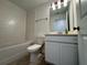 Clean, well-lit bathroom with a shower/tub, toilet, and vanity at 15098 Windflower Aly, Winter Garden, FL 34787