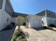 Charming townhome exterior featuring a private one car garage and beautiful landscaping at 15098 Windflower Aly, Winter Garden, FL 34787