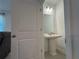 This powder room features a pedestal sink, modern lighting, and updated fixtures at 15098 Windflower Aly, Winter Garden, FL 34787