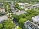 Aerial view of a residential neighborhood with mature trees and community amenities at 1630 Common Way Rd # 303, Orlando, FL 32814