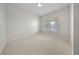 Neutral bedroom with window, plush carpeting, and ample natural light at 1630 Common Way Rd # 303, Orlando, FL 32814