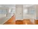 Open-concept living area with hardwood floors flowing into the modern kitchen at 1630 Common Way Rd # 303, Orlando, FL 32814