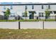 The home's backyard is surrounded by a black metal fence, which provides safety and peace of mind at 16447 Bird Of Paradise Ave, Clermont, FL 34714