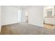Bedroom with neutral carpet and doors to additional rooms at 16447 Bird Of Paradise Ave, Clermont, FL 34714