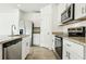 Well-equipped kitchen featuring stainless steel appliances, granite countertops, and ample cabinet space at 16447 Bird Of Paradise Ave, Clermont, FL 34714