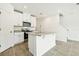 Modern kitchen with stainless steel appliances, granite countertops, and a central island at 16447 Bird Of Paradise Ave, Clermont, FL 34714