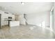Open floor plan combines living space and modern kitchen with island seating at 16447 Bird Of Paradise Ave, Clermont, FL 34714