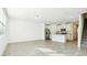 Open-concept living space with stainless steel appliances and modern finishes at 16447 Bird Of Paradise Ave, Clermont, FL 34714