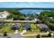 Aerial view of the neighborhood with a lake view, well manicured lawns and stunning home exteriors at 17106 Guilford Ct, Orlando, FL 32820