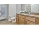 This bathroom offers a single sink vanity and a shower over tub at 17106 Guilford Ct, Orlando, FL 32820