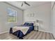 Cozy bedroom features a comfortable bed, ceiling fan, and stylish decor at 17106 Guilford Ct, Orlando, FL 32820