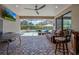 Relaxing screened lanai with comfortable seating overlooking the pool at 17106 Guilford Ct, Orlando, FL 32820