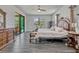 Spacious main bedroom with pool views, tile flooring, and a luxurious ensuite bathroom at 17106 Guilford Ct, Orlando, FL 32820