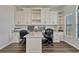 Functional office features custom built-in shelving, storage, and a spacious desk area at 17106 Guilford Ct, Orlando, FL 32820