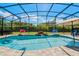 Beautiful screened pool with lush landscaping and a waterfall feature at 17106 Guilford Ct, Orlando, FL 32820