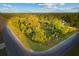 Beautiful aerial view of a wooded lot at the corner of a quiet neighborhood at 18026 Reynolds Pkwy, Orlando, FL 32833