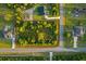 Aerial view of a vacant lot surrounded by mature trees and a quiet neighborhood at 18026 Reynolds Pkwy, Orlando, FL 32833