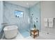 Bathroom showcasing a sleek soaking tub and a walk-in shower with gorgeous marble-like tiling at 18026 Reynolds Pkwy, Orlando, FL 32833
