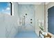 Modern bathroom features a spacious glass shower with premium fixtures and marble-like tile at 18026 Reynolds Pkwy, Orlando, FL 32833