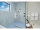 Bathroom showcasing a walk-in shower with premium fixtures and marble-like tile at 18026 Reynolds Pkwy, Orlando, FL 32833
