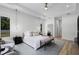 Bright, spacious bedroom featuring tray ceilings, pendant lighting, and neutral decor at 18026 Reynolds Pkwy, Orlando, FL 32833