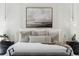 Close up of the bed in the primary bedroom featuring neutral decor and lots of pillows at 18026 Reynolds Pkwy, Orlando, FL 32833