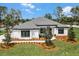 Beautiful home featuring a landscaped yard and dark trim windows at 18026 Reynolds Pkwy, Orlando, FL 32833