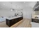 Open-concept kitchen featuring a large island, seating, and stainless steel appliances at 18026 Reynolds Pkwy, Orlando, FL 32833