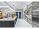 Spacious kitchen featuring a large island with bar seating and stainless steel appliances at 18026 Reynolds Pkwy, Orlando, FL 32833