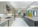 Gourmet kitchen with stone countertops, stainless steel appliances, custom cabinetry, and large island with seating at 18026 Reynolds Pkwy, Orlando, FL 32833