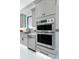 Modern kitchen with stainless steel appliances and sleek cabinetry providing ample storage at 18026 Reynolds Pkwy, Orlando, FL 32833