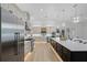 Spacious kitchen showcasing a large island, stainless steel appliances, a farmhouse sink, and ample cabinet space at 18026 Reynolds Pkwy, Orlando, FL 32833