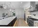 Bright kitchen featuring stainless steel appliances, a large island with seating, and pendant lighting at 18026 Reynolds Pkwy, Orlando, FL 32833