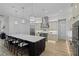 Modern kitchen with stainless steel appliances, a large island, and pendant lighting at 18026 Reynolds Pkwy, Orlando, FL 32833