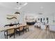 Open-concept living room features a modern decor with views into the kitchen at 18026 Reynolds Pkwy, Orlando, FL 32833