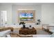 Beautiful living room with stylish furniture, a unique wooden coffee table, and a modern entertainment center at 18026 Reynolds Pkwy, Orlando, FL 32833