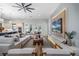 Spacious open living area featuring modern decor, an entertainment center, and seamless access to the kitchen at 18026 Reynolds Pkwy, Orlando, FL 32833