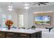 Open-concept space combining kitchen and living areas, featuring modern lighting and cozy seating at 18026 Reynolds Pkwy, Orlando, FL 32833