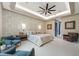Main bedroom featuring a decorative accent wall, ambient lighting, and a ceiling fan at 18026 Reynolds Pkwy, Orlando, FL 32833