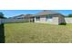 Spacious backyard offering ample green space with a privacy fence at 1918 Marabou Dr, Davenport, FL 33896
