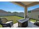 Beautiful backyard featuring a well-manicured lawn, chairs and table, and privacy fence at 1918 Marabou Dr, Davenport, FL 33896
