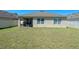 Large backyard featuring a well-manicured lawn and privacy fence at 1918 Marabou Dr, Davenport, FL 33896