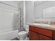 Bathroom featuring a shower over tub with curtain, neutral colors, and sink at 1918 Marabou Dr, Davenport, FL 33896