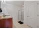 Bathroom featuring double sinks, tile floor, and a glass-enclosed shower at 1918 Marabou Dr, Davenport, FL 33896