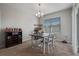 The dining area features a modern light fixture, dark table, and a large window at 1918 Marabou Dr, Davenport, FL 33896