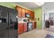 This kitchen features stainless steel appliances, tile backsplash, and wood cabinets at 1918 Marabou Dr, Davenport, FL 33896